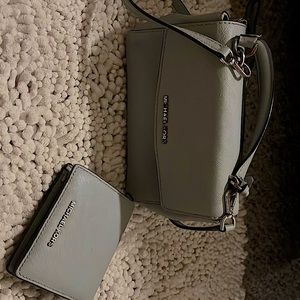 Super cute light blue MK purse and wallet . Good condition.